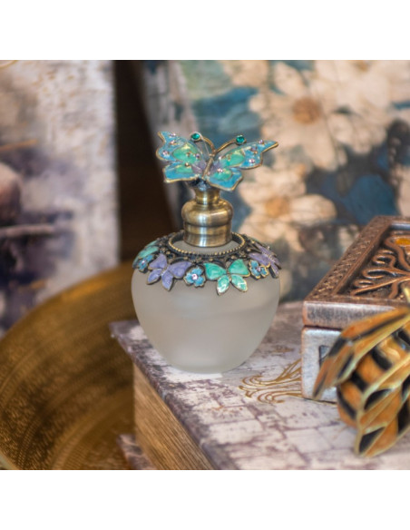 Botella de perfume mariposa