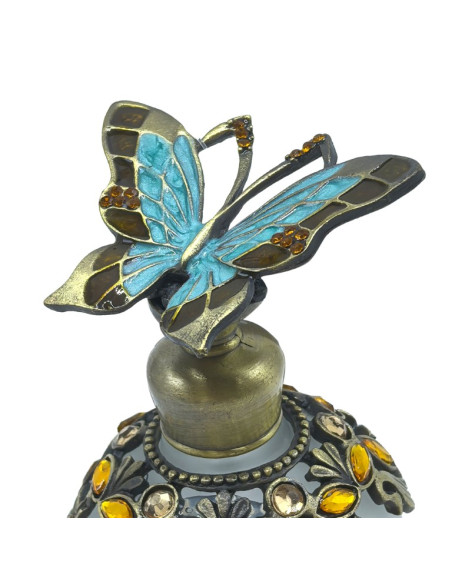 Botella de perfume mariposa