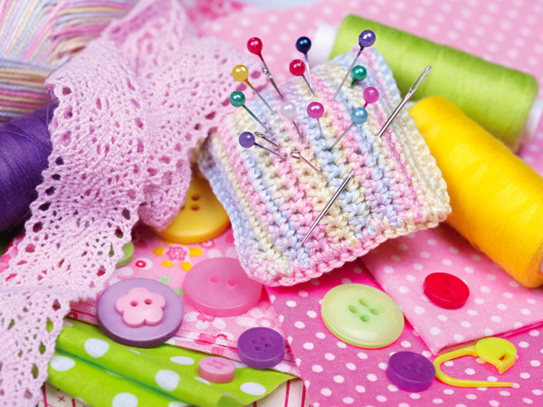 Coser botones a cojines